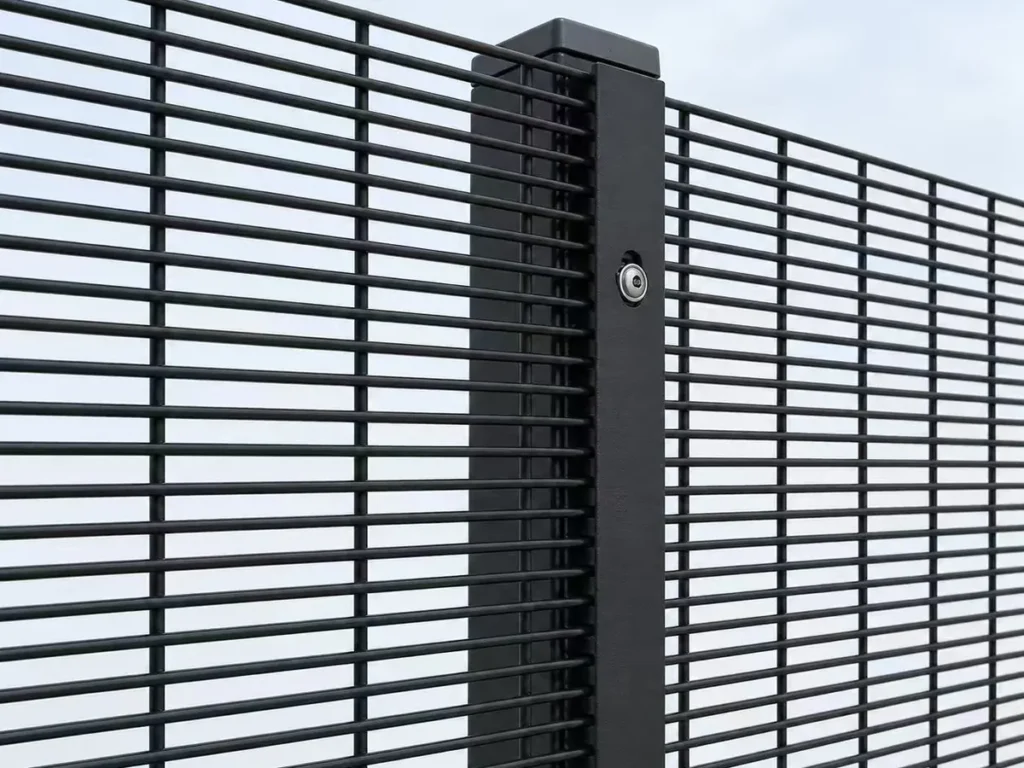 Black 358 anti-climb mesh panels fixed to a post with clamp bar and security bolt