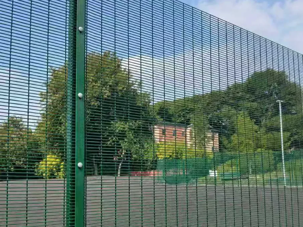 Green 358 fence along a sports ground perimeter