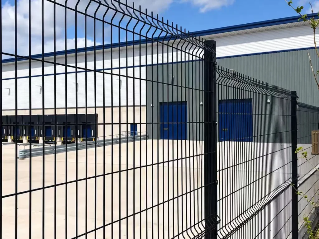 Black 3D fence securing a warehouse and logistics site