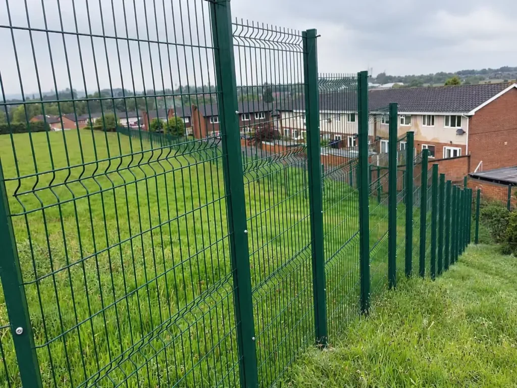 3D fence along a residential boundary on sloping ground