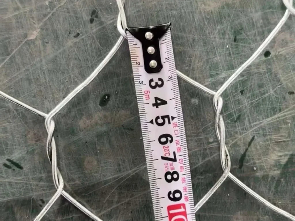 Mesh opening measured with a tape on galvanized hexagonal mesh