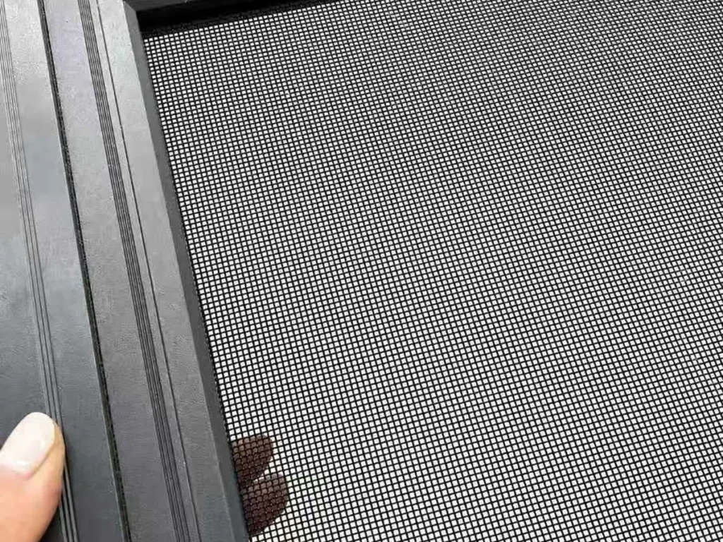 Security mesh fitted in a black aluminium screen frame