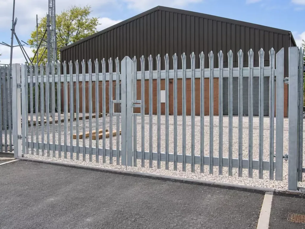 Hot-dip galvanized palisade fence and gate around a utility site