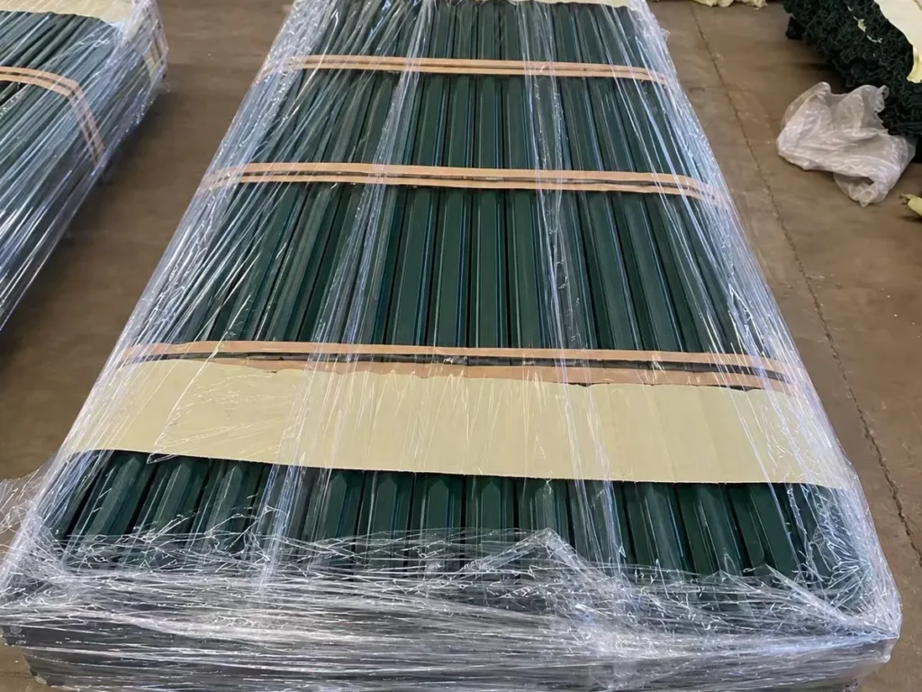 Green palisade pales banded and stretch-wrapped for export