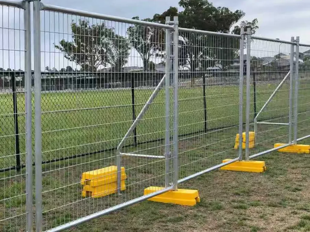 Temporary fence with stay braces and weighted feet on open ground