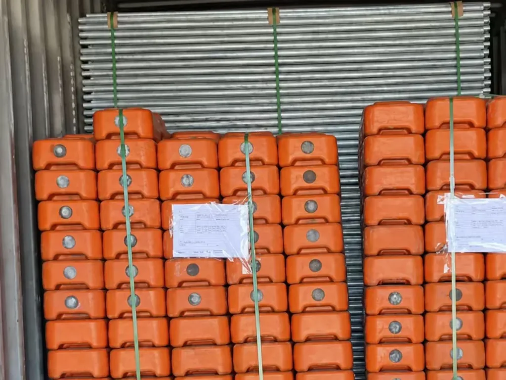 Panels and plastic feet loaded in a container for export
