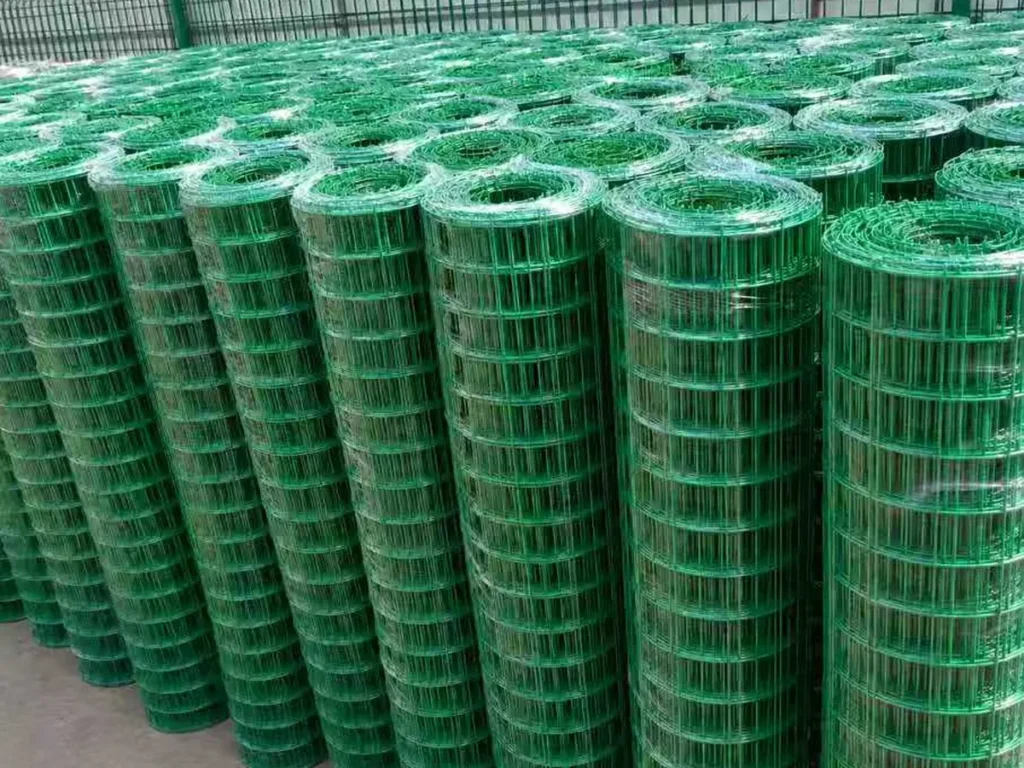 Green PVC-coated welded mesh rolls ready for dispatch
